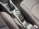 a close up of a car ' s interior with a gear stick