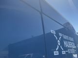 a reflection of a truck on the side of the road