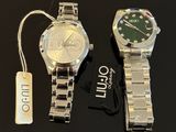 two watches sitting next to each other on a table