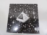 the beer box is open on a white surface with stars and sparkles