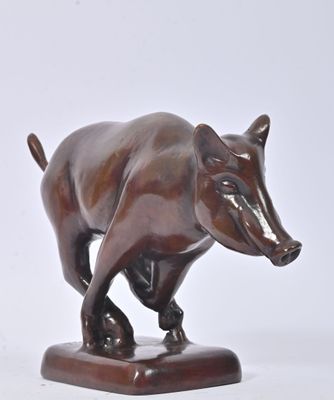 statue of a bull on a wooden base on a white background