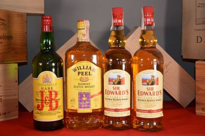 several bottles of different types of alcohol are lined up on a table