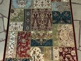 a rug on the floor with many different colors and patterns