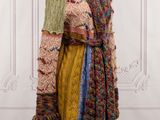 an image of a dress on a mannequin stand in front of a wall