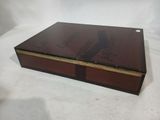 an image of a box with a book on it sitting on a white surface