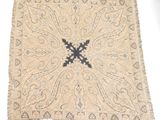 an image of a rug with a cross on the middle of it