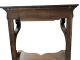 a wooden table with a black top on a white background