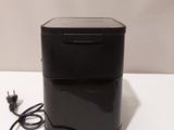 an image of a black box with a power cord attached to it