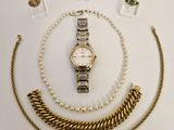 several pieces of jewelry including a watch, bracelet, and ring
