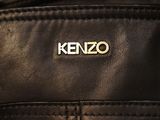 the back of a black leather jacket with a kenzo logo on it