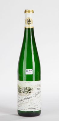 a bottle of wine that is sitting on a table