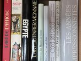 many books that are in a box on the table