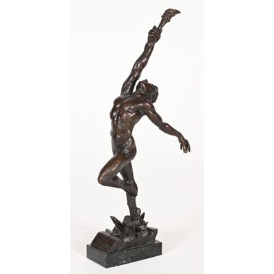 a bronze statue of a man holding a basketball ball