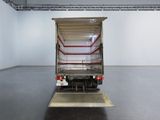 an image of a truck parked in a large room