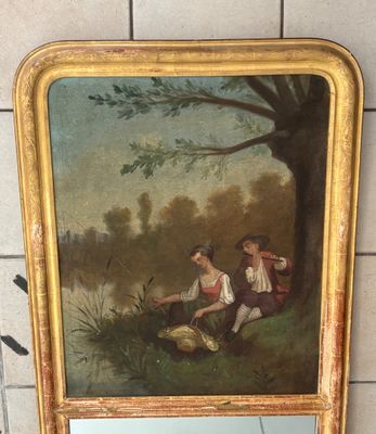 une photo d'un tableau sur le mur d'une salle de bain