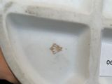 a white plate with a label on it that says don ' t eat