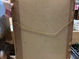 a person that is holding a picture in a box