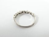 a close up of a silver ring on a white surface