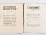 two pages of an old book on a white table