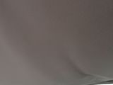 a person sitting in the back seat of a car looking out the window