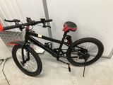 a bike that is sitting on the floor next to a door