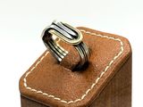 a ring that is sitting on top of a wooden box