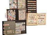 a lot of different stamps on display in a book