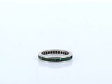 an image of a ring with a green stone in it