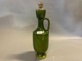 an image of a green vase sitting on top of a table