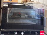 a toaster oven sitting on top of a counter in a kitchen