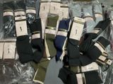 several pairs of men ' s socks are wrapped in plastic