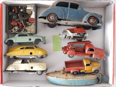 toy cars in a box on a white surface