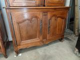a wooden cabinet with a mirror on top of it