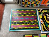a picture of a room that has some art on the floor