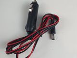 a close up of a car charger on a white surface