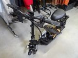 a scooter that is sitting on the floor in a room