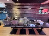 many pans and pans on a table in a restaurant