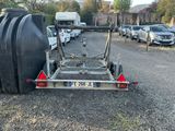 a trailer with a trailer attached to it in a parking lot