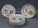 several plates with different designs on them on a gray surface