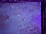 a picture of a mirror with a purple light in it