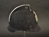 a black hat with a gold leaf on the top of it