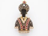 a close up of a statue of a person wearing a crown