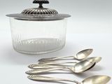 five spoons and a glass jar with a lid