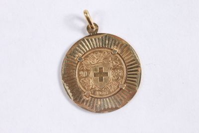 l'image d'une pièce d'or sur laquelle figurent des armoiries