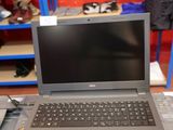 a laptop computer sitting on top of a desk