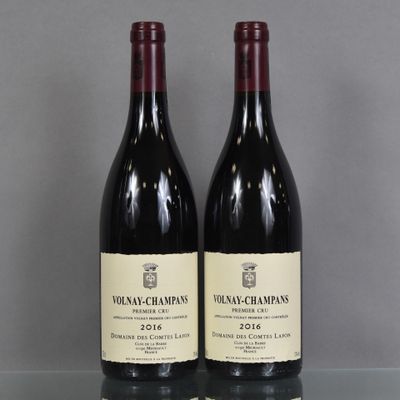 two bottles of wine sitting on top of a table next to each other