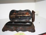 an old sewing machine sitting on top of a table