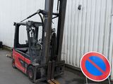 a fork lift truck that is parked next to a no parking sign