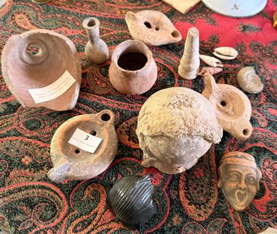 many different types of pottery on the table