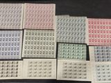 a table topped with lots of different types of stamps on top of each other